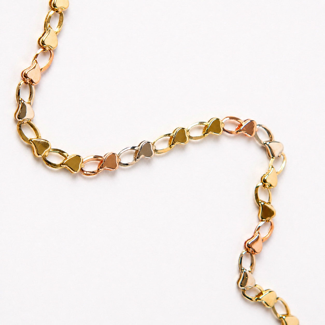 PULSERA CORAZONES EN 3 OROS DE 14K