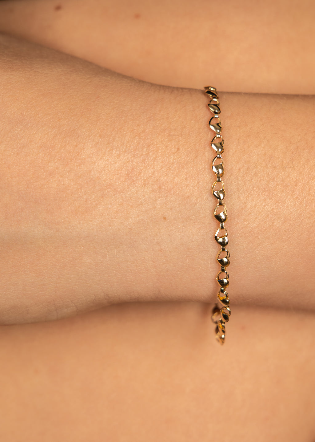 PULSERA MITAD CORAZONES ORO AMARILLO 14K